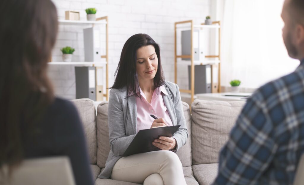 Psychologist talking to couple