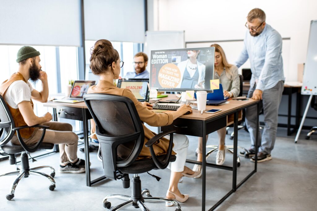 web designers in a table and working